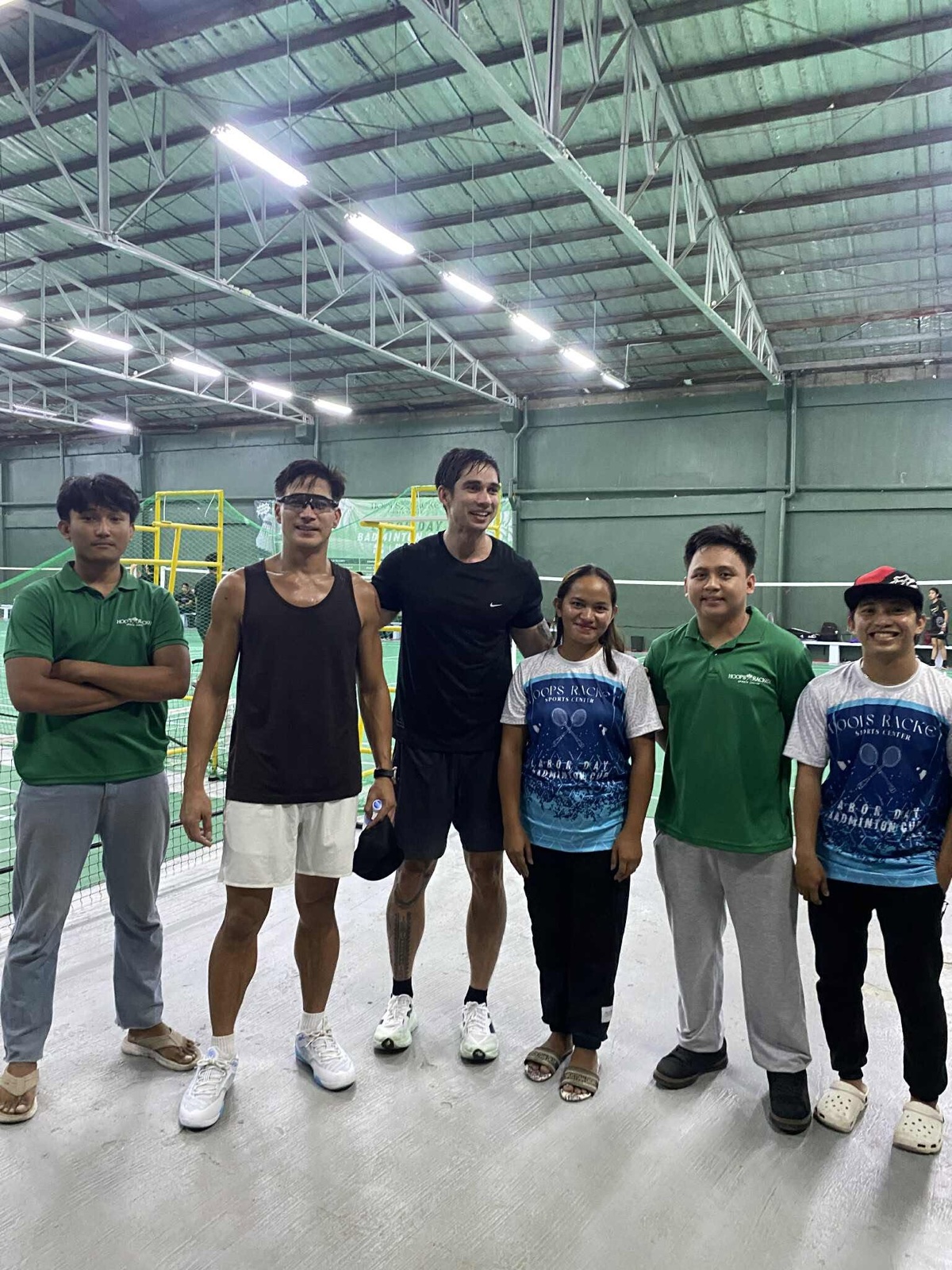 Hoops & Racket staff welcoming players after a badminton event