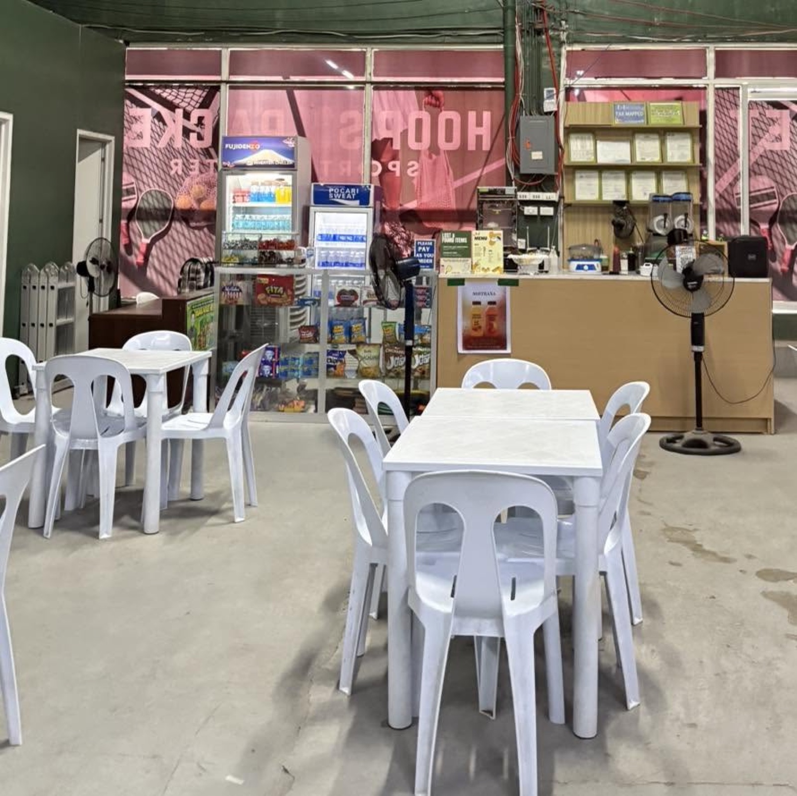 The seating and refreshment area at Hoops & Racket